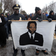 St. Louis Police Chief John Hayden and Director of Public Safety Jimmie Edwards carry a banner in the Martin Luther King Jr. parade on Monday down the city’s Dr. Martin Luther King Drive. (Laurie Skrivan/ St. Louis Post-Dispatch)